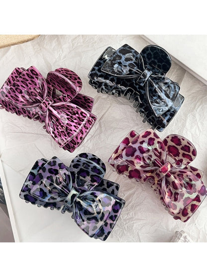 Close-up of Beau leopard print bow claw clip showing textured pattern