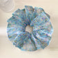 Gifty scrunchie displayed flat showing full floral vintage print design