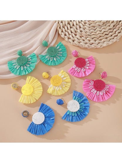 Earedge fan shaped drop earrings displayed on a jewelry stand