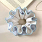 Top view of Gifty color block scrunchie displaying ruched fabric detail