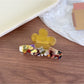 Beau claw clip placed on a wooden surface with natural lighting