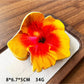 Beau hibiscus claw clip shown with matching floral accessories