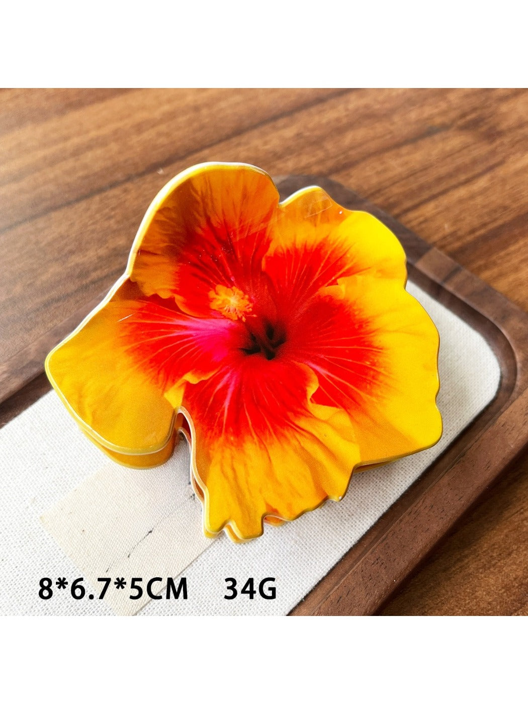 Beau hibiscus claw clip shown with matching floral accessories