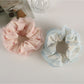 Side view of Gifty tulle ruffle scrunchie highlighting layered floral fabric
