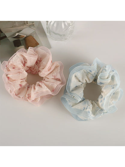 Side view of Gifty tulle ruffle scrunchie highlighting layered floral fabric
