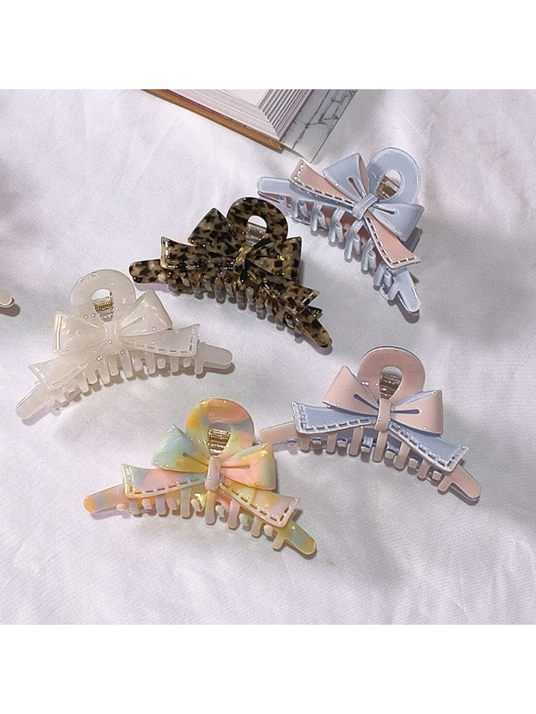 Close-up of Beau acetate bow shaped claw clip highlighting glossy finish