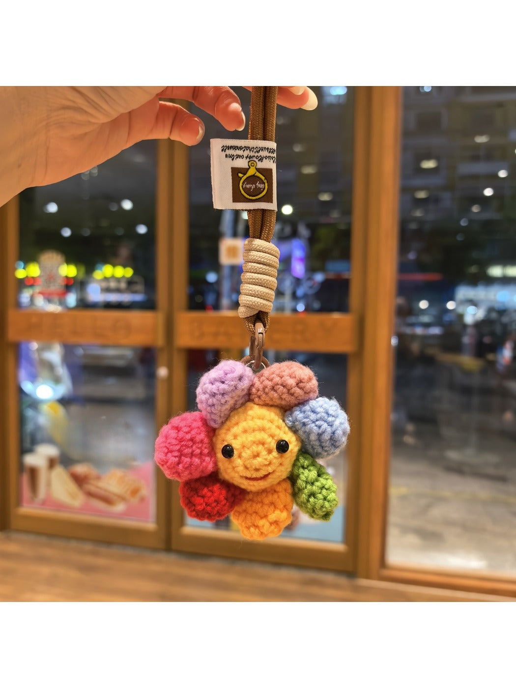 Keypus keychain showing detailed flower charm with soft pink and white petals
