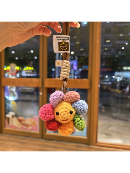 Keypus keychain showing detailed flower charm with soft pink and white petals