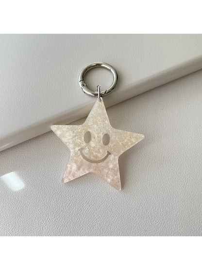 Five pointed star pendant keychain shown from a side angle on a white background