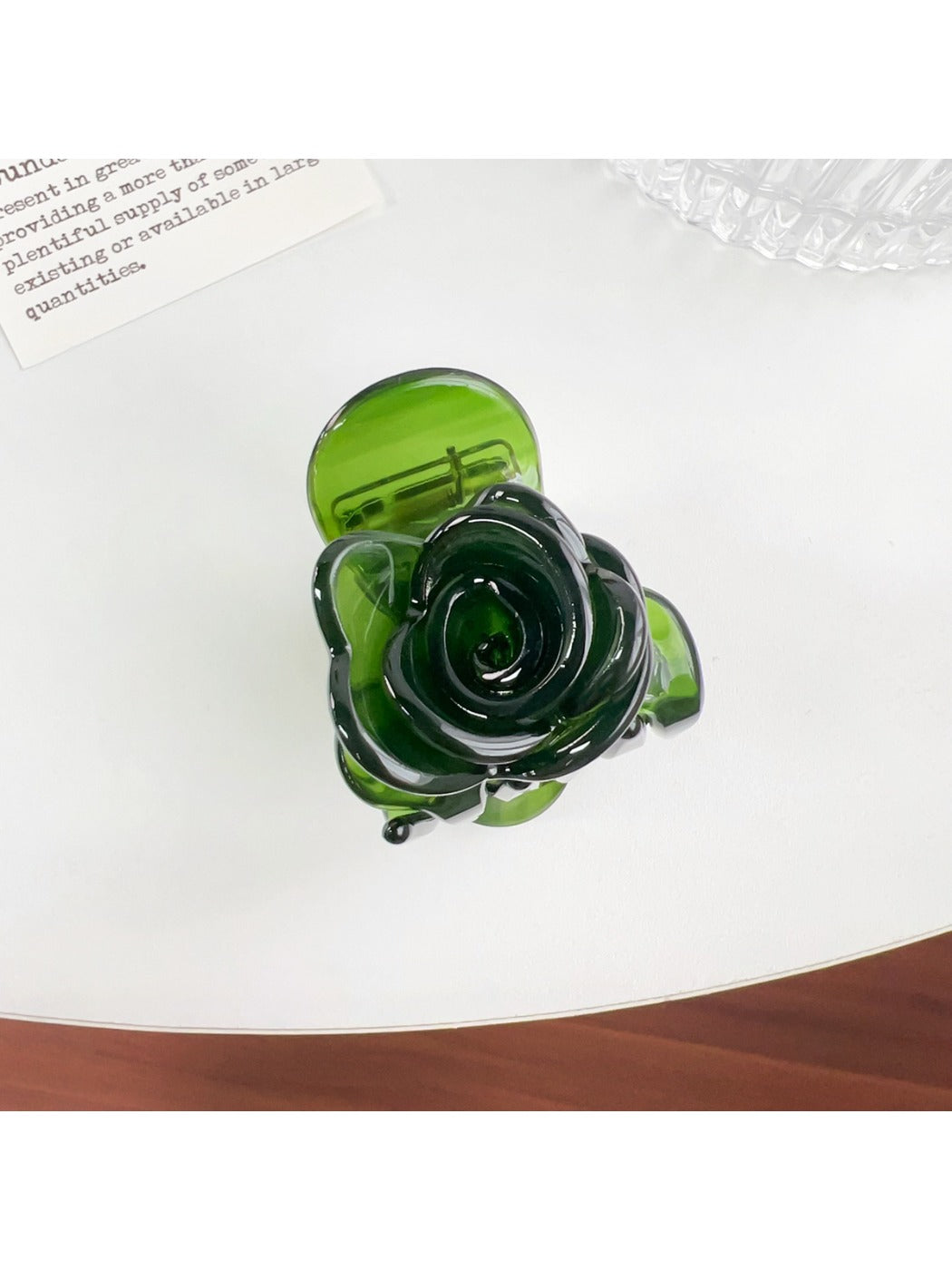 Beau Sweet Rose hair claw clip displayed on a flat surface showing rose design