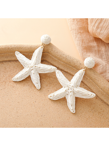 Detailed view of the woven raffia pattern on the starfish stud earrings