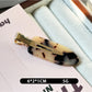 Top view of Beau acetate invisible hair clip showing glossy finish