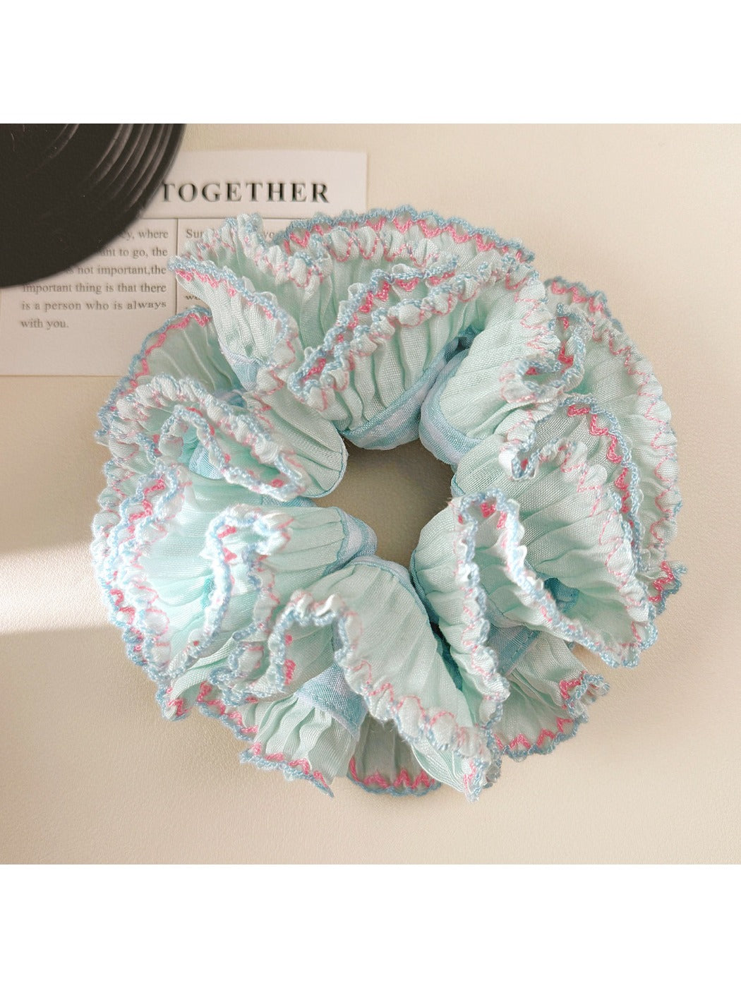 Double layer blue ruffle scrunchie with soft fabric texture