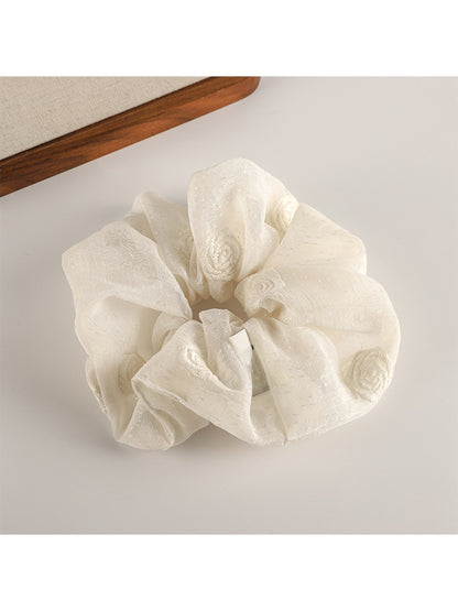 Gifty scrunchie packaged in minimalist branded box with logo