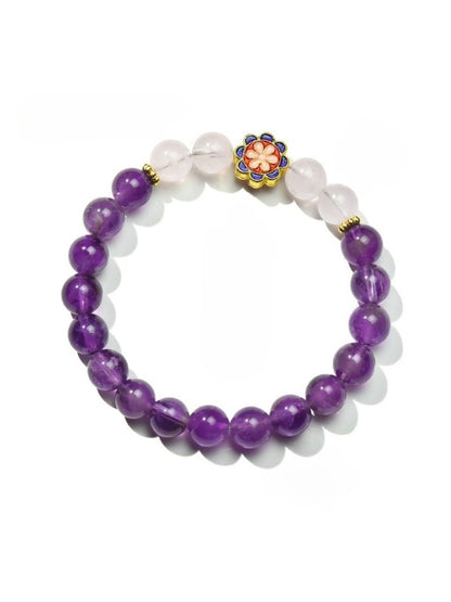 Lovra bracelet laid flat showing full length with floral accents and mixed beads