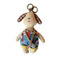 Multiple fabric puppy keychains in different colors arranged on a white background