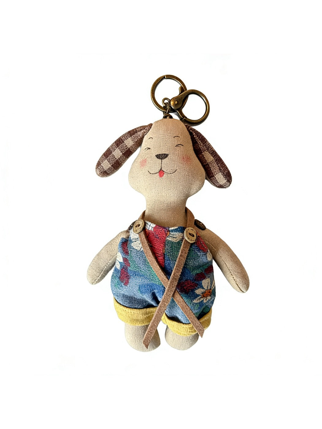 Multiple fabric puppy keychains in different colors arranged on a white background