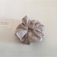 Gifty scrunchie wrapped around a wrist as a fashion accessory