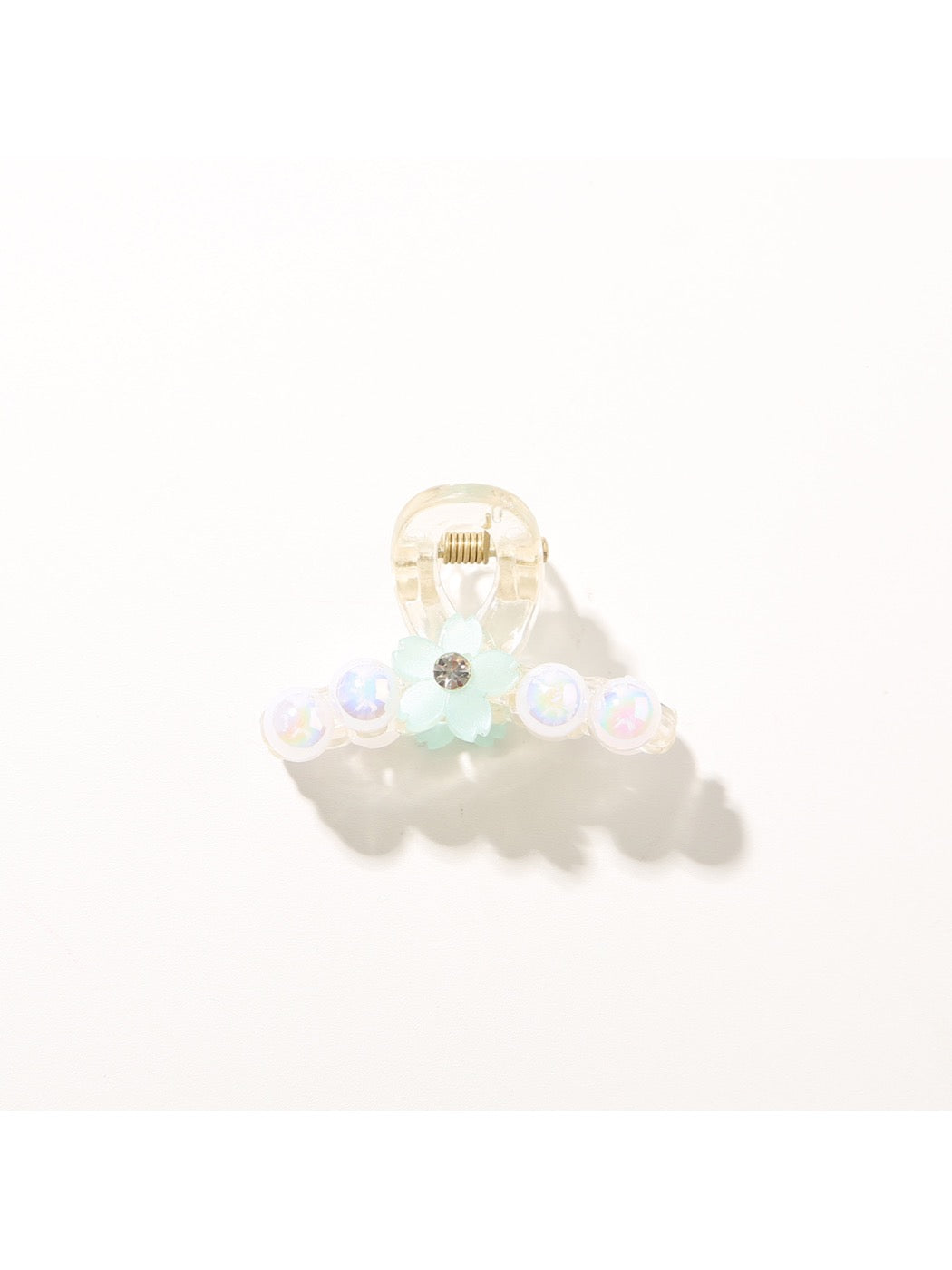 Bright multi color hair clip with visible metal clasp mechanism