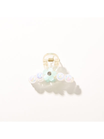 Bright multi color hair clip with visible metal clasp mechanism