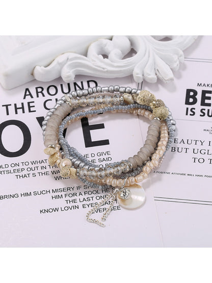 Lovra multi-row bracelet with a mix of pastel and bright beads on a neutral background