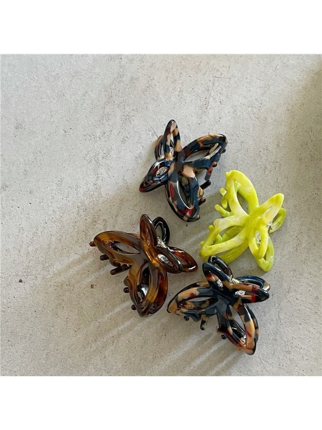 Beau Misty Acetate Butterfly Hair Clip held in hand showing size and scale