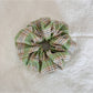 Multiple Gifty Sweet Green Style Scrunchies stacked together highlighting fabric details