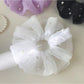 Side view of Gifty elegant tulle scrunchie showing layered fabric design