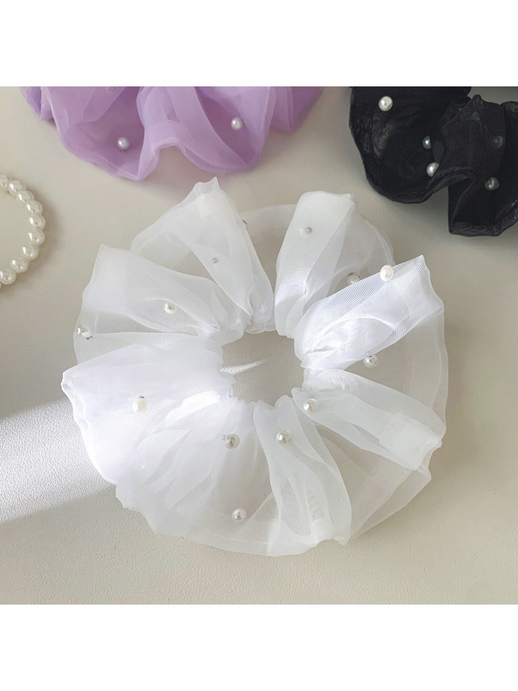 Side view of Gifty elegant tulle scrunchie showing layered fabric design