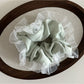 Gifty vintage tulle ruffle scrunchie with soft, sheer fabric and gathered ruffles