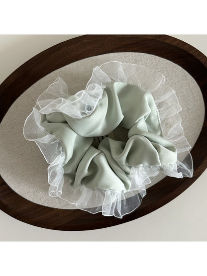 Gifty vintage tulle ruffle scrunchie with soft, sheer fabric and gathered ruffles