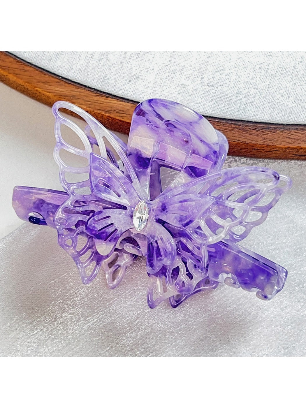 Beau elegant hair claw clip displayed with matching butterfly accessories