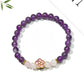 Close-up of Lovra bracelet showing detailed floral accents and gold beads