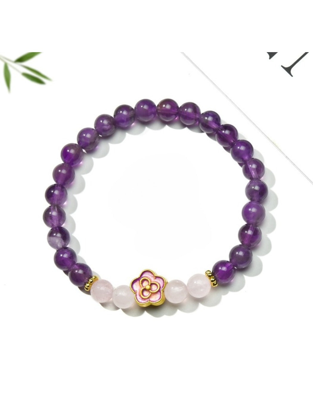 Close-up of Lovra bracelet showing detailed floral accents and gold beads