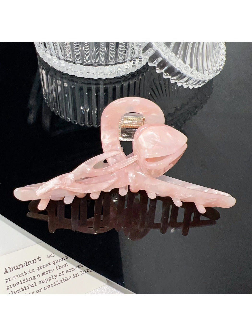 Beau hair claw clip close-up showing colorful flower details and glossy finish