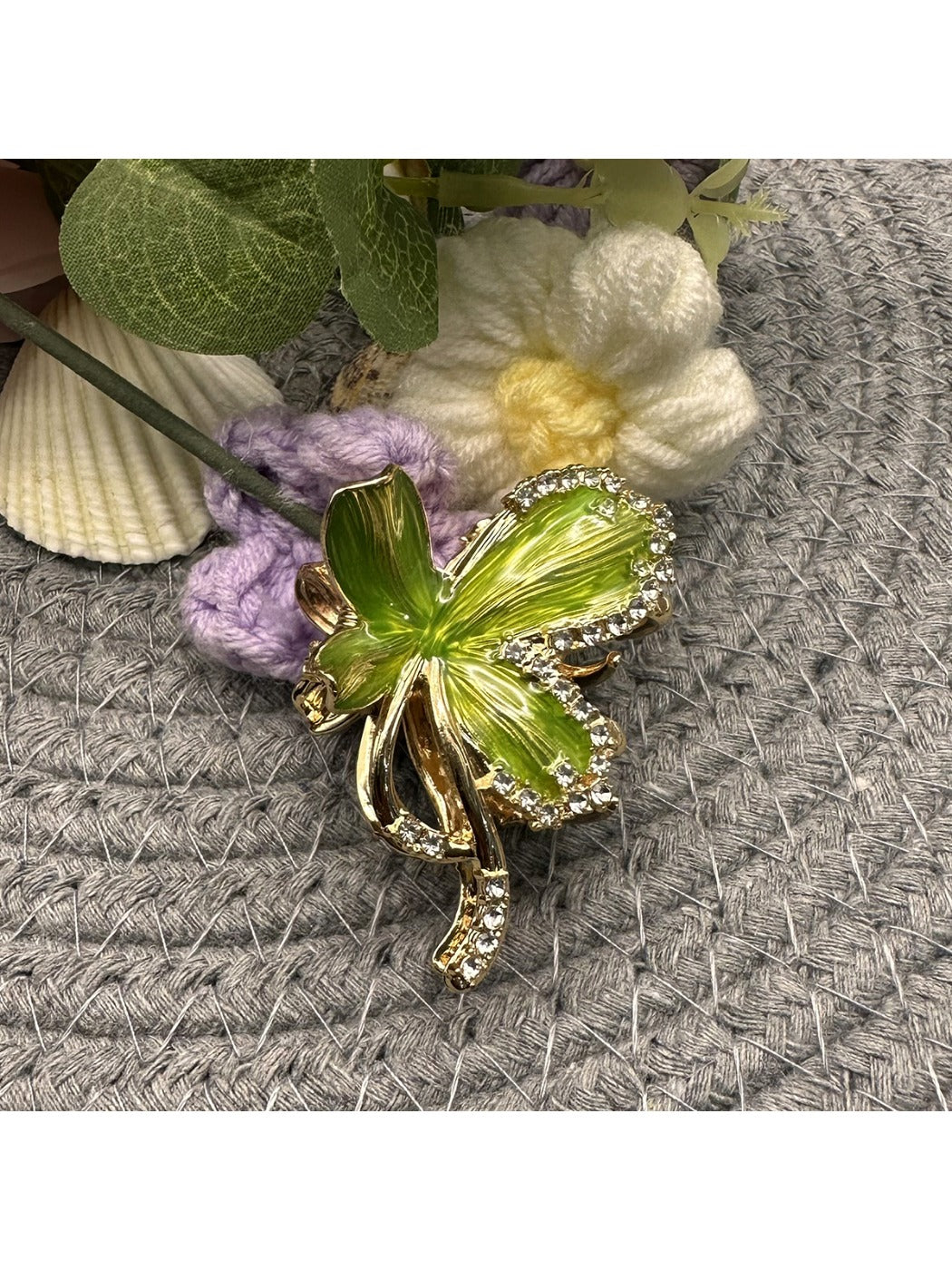 Beau flower hair clip worn in blonde hair, displaying colorful petals