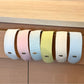 Gifty headband displayed flat highlighting its wide design and solid color