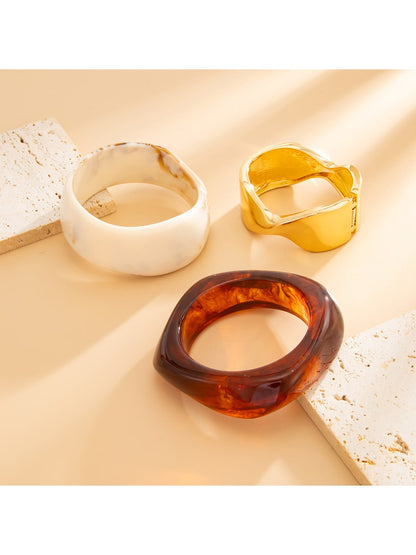 Side view of Lovra vintage marble pattern wide bracelet highlighting thickness and texture