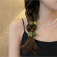 Gifty - Double Strand Smiley Heart Charm Hair Tie