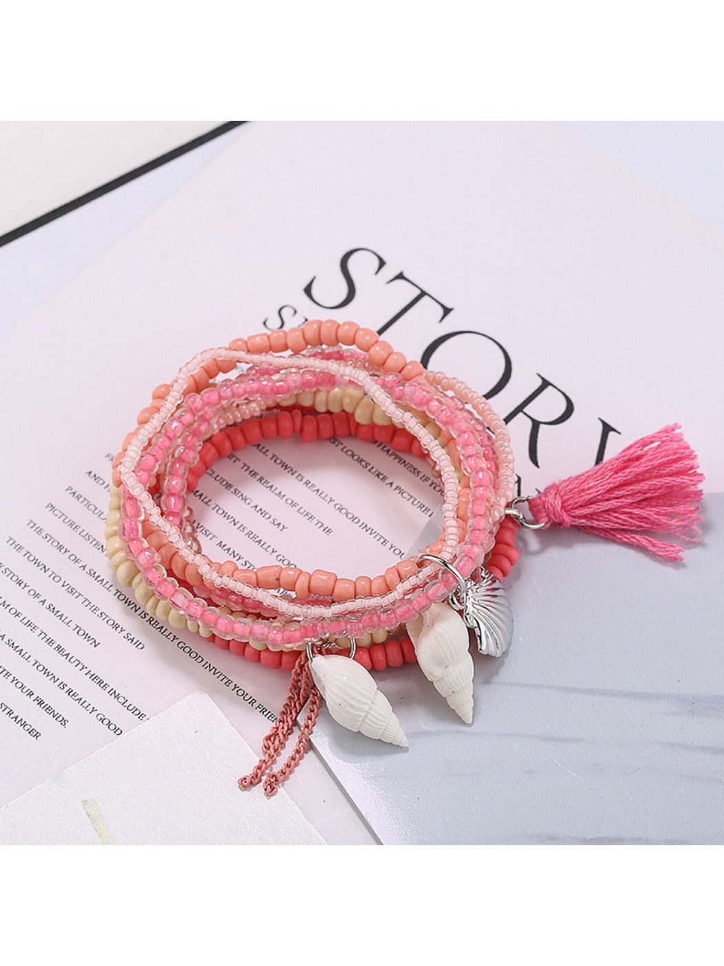 Lovra multi-row beaded bracelet displayed flat with ocean-inspired colors