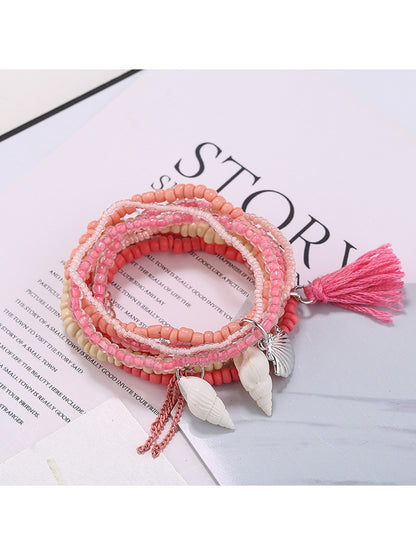 Lovra multi-row beaded bracelet displayed flat with ocean-inspired colors