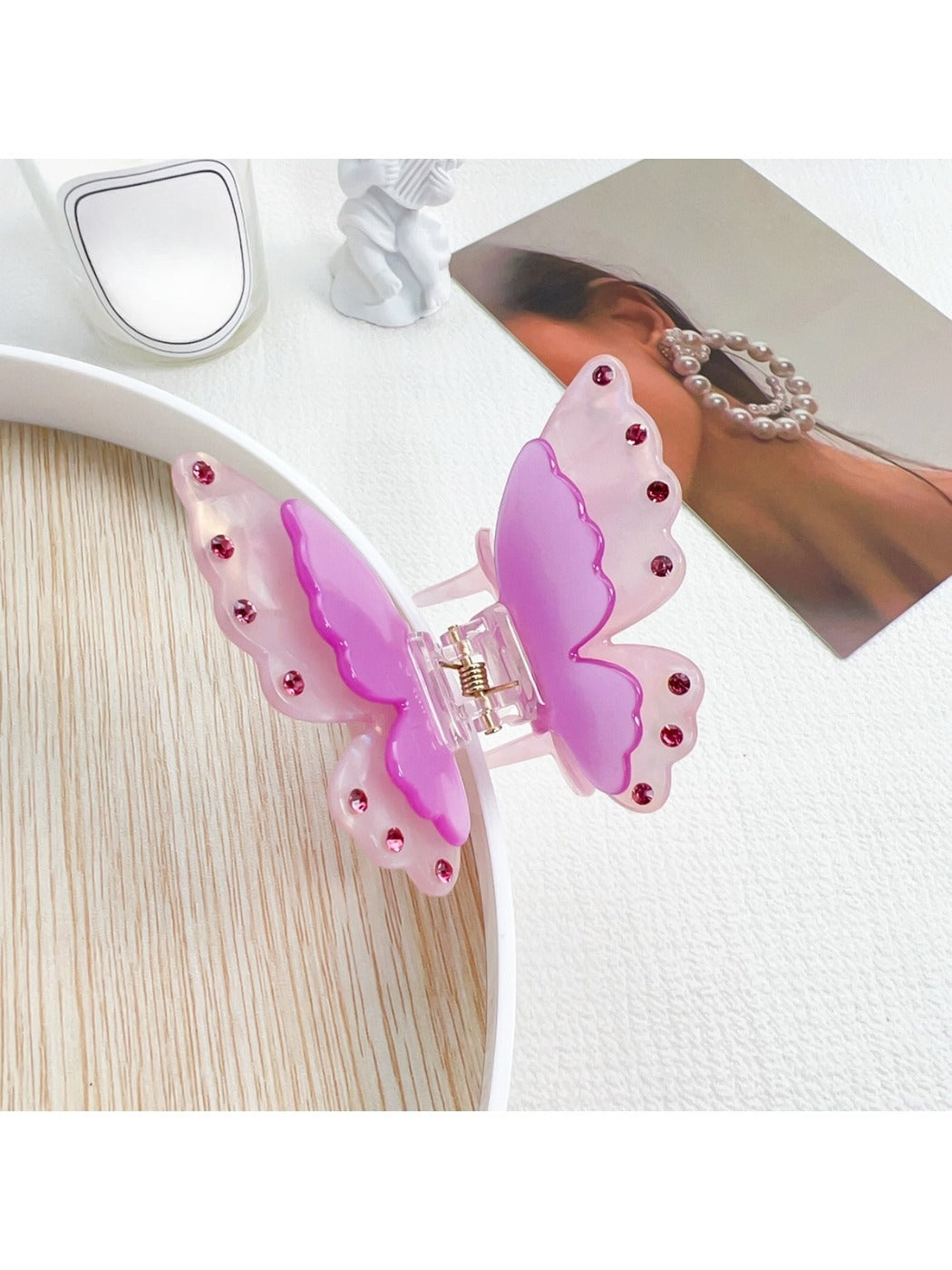 Beau two tier butterfly claw clip in pastel pink with soft shadows