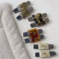 Beau vintage flat hair clip in matte gold finish on white background