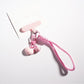 Side view of candy color heart keychain highlighting its thickness and rounded edges
