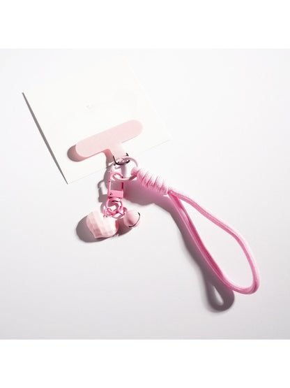Side view of candy color heart keychain highlighting its thickness and rounded edges