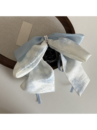 Beau bow ribbon streamer claw clip with multiple ribbon layers in pastel pink shades