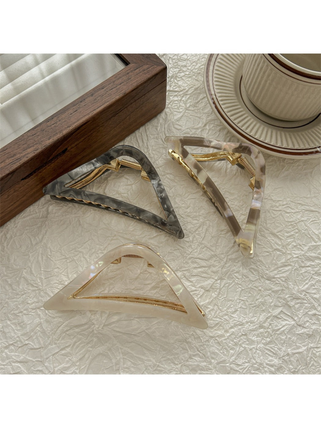 Close-up of Beau triangle claw clip showing hollow design and teeth