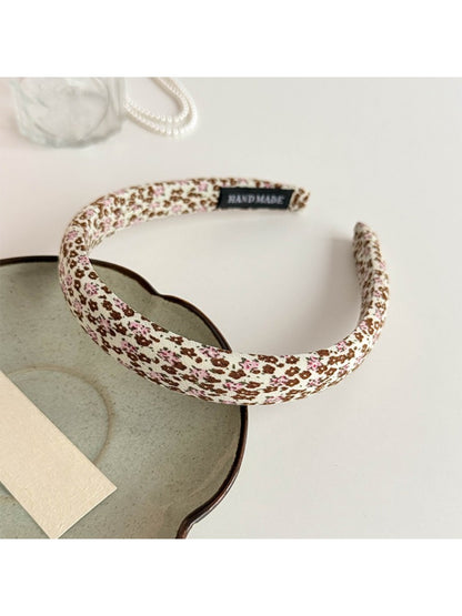 Gifty headband with delicate tiny flowers in pastel colors