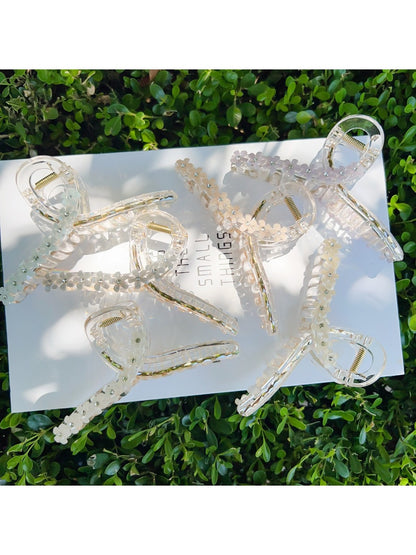Beau flower crisscross hair claw clip in beige on white background