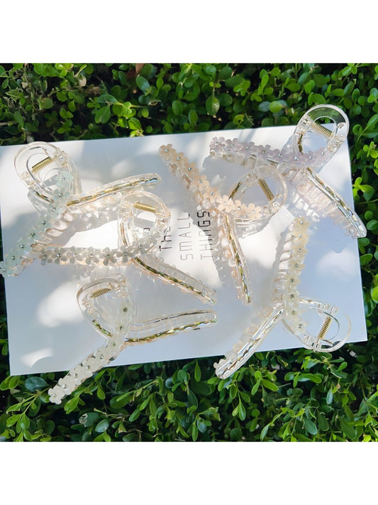 Beau flower crisscross hair claw clip in beige on white background